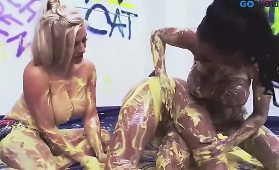 Lesbians in Yellow Paint Orgy Spreading and Licking